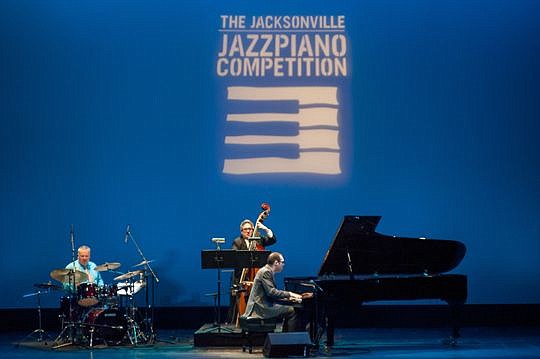Matt Villinger, one of the five finalists in The Jacksonville Jazz Piano Competition, plays one of his own compositions, "Chill's Blues," with backing by Clyde Conner on drums and Dennis Marks on bass at the Florida Theatre on Thursday night. The comp...