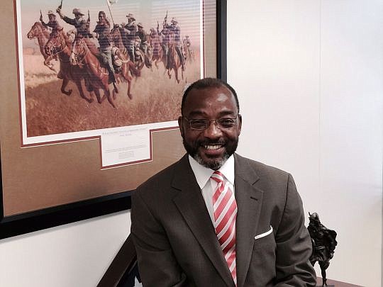 Cleve Warren's office at Florida State College at Jacksonville features the work "Buffalo Soldiers: Advance as Skirmishers, Charge!" by Frank C. McCarthy. It features a quote by retired Army Gen. Colin Powell, the first African-American of the Joint C...
