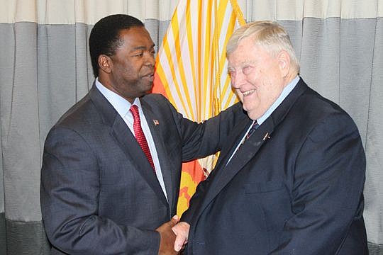 Mayor Alvin Brown and Police and Fire Pension Fund Administrator John Keane shake hands Friday, minutes after Brown signed a deal for pension reform into law.