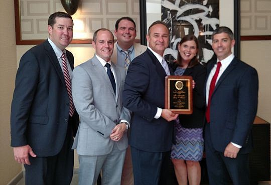 From left are, Christian George, YLS secretary and 4th Judicial Circuit YLD representative; Michael Lockamy, 4th Judicial Circuit YLD representative; County Court Judge Eric Roberson, YLS treasurer; County Court Judge Gary Flower, with his outstanding...
