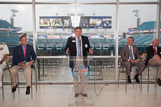 Jacksonville Sports Council CEO Rick Catlett talks about Jacksonville hosting Notre Dame-Navy next year at EverBank Field. He was joined at the Wednesday news conference by, from left, retired U.S. Navy Adm. Bob Natter, Mayor Lenny Curry and sports co...