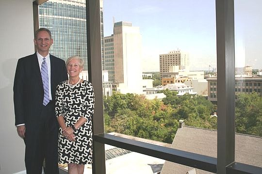 After years of being friends, Bob Joel and Mary "Biggs" Knauer are co-workers at Salvus Wealth Management in Downtown.