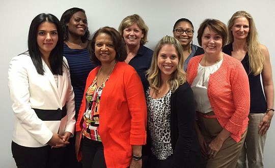 Missing Link volunteers Tuesday included, front row: Shahdokht Rasouli, Kathy Pannell, Jennifer Alfonso and Natalie Tuttle; and back row: C.J. Donewa, Carol Benjamin, Summer Burnley and Holly Mathews.