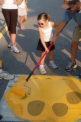 The annual painting of the paw prints along Bay Street is Saturday morning.