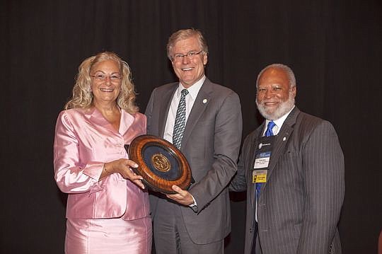 William Van Nortwick Jr. received The Florida Bar Foundation's Medal of Honor Award from Ava Doppelt, secretary of The Florida Lawyers Mutual Insurance Co., which sponsored the award, and immediate past foundation President Emerson R. Thompson Jr.