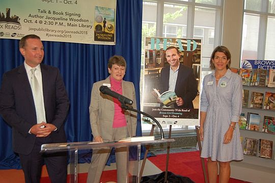 From left, Mayor Lenny Curry, Jacksonville Public Library Director Barbara Gubbin and Erin Vance Skinner, chair of the library board of trustees, unveiled the poster for the Jax Reads campaign.