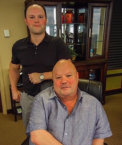 Frank Gatlin (seated) and his son, Frankie, are the principals of Gatlin Development Co.