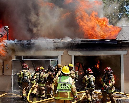 Jacksonville Fire and Rescue Department safety officers respond to the scene of major fires.