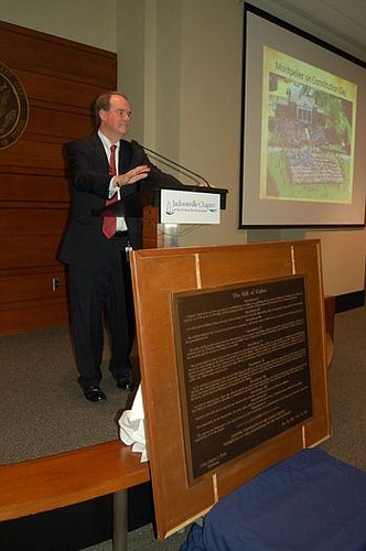 U.S. District judge Timothy Corrigan with a Bill of Rights plaque that will be displayed inside the U.S. Courthouse.