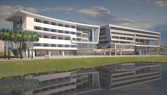 UF Health expects to open its 92-bed hospital, left, by early 2017 next to the existing medical building in North Jacksonville.