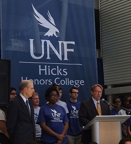 University of North Florida President John Delaney, right, announces a $7 million donation Thursday from Ann and David Hicks. The funds will be used to create the Hicks Honors College, the sixth college at the university.