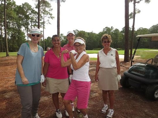 Judy McInnis, second from right, celebrates winning a two-year lease of a 2015 Lexus NX200 after hitting a 100-yard hole-in-one. Also pictured are Carol Miller, Tonia Yazgi, Dawn Alexander and Linda Pek. They were participating in the Old City Classic...