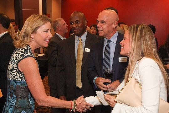 From left, tennis champion Chris Evert greets MaliVai Washington, Florida Blue CEO Pat Geraghty and his guest, Inger Loftheim, at the Champions for Children Gala.