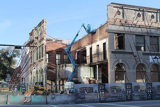 The Bostwick Building is being dismantled one brick at a time as part of the renovation for the future site of the Cowford Chophouse.