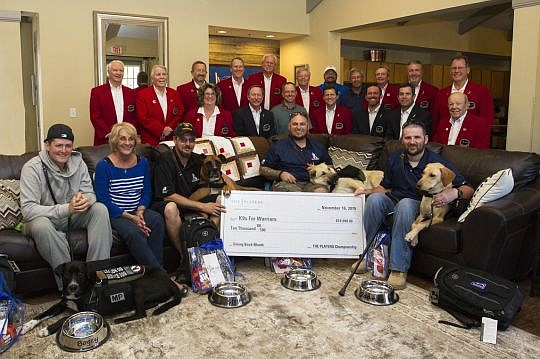 The Players Championship past tournament chairs dropped off gifts, including new laptops, when they visited K9s For Warriors.