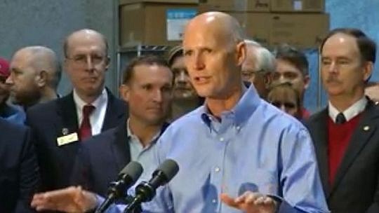 Gov. Rick Scott unveiled his budget Monday during a visit to Harbinger Sign in Jacksonville.