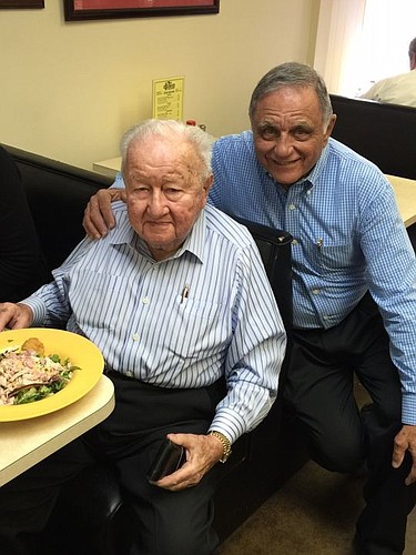 Beaver Street Fisheries Chairman Harry Frisch and Two Doors Down owner Norm Abraham. Frisch ate at the restaurant several times a week. Abraham designated a table there for Frisch and his associates.