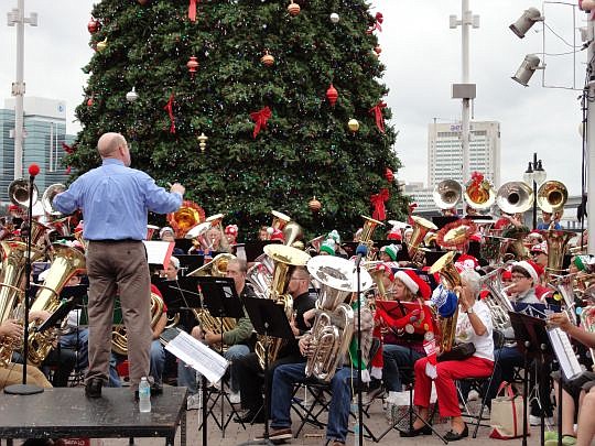 More than 100 big-brass musicians will take over the courtyard at the Jacksonville Landing at 2 p.m.