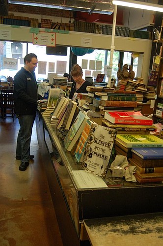 Don Godfree was visiting Jacksonville from Atlanta on Friday and stopped at Chamblin's Uptown to talk books with manager Jennifer O'Donnell.