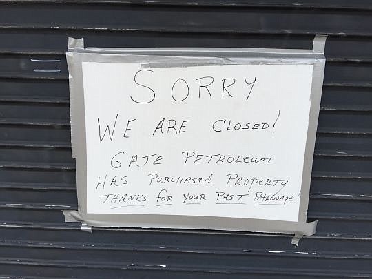 A sign at Two Doors Down restaurant, which closed last week. Gate Petroleum Co. wants to buy the 400 block of Park Street to develop a gas station and convenience store.