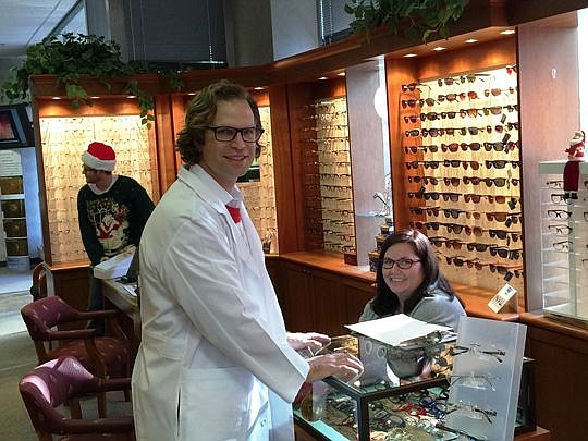 Dr. Jeffrey Brown and Amanda Moreland, an optical technician, at Jax Vision Care Downtown at 100 W. Bay St. The office will move three blocks north, closer to City Hall and the courthouses.
