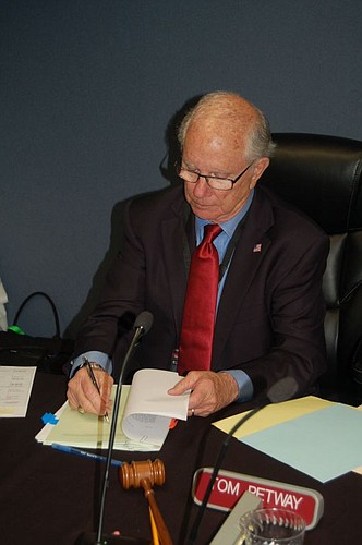 JEA Board of Directors Chair Tom Petway signed some financial documents Tuesday following the board's final meeting of 2015.