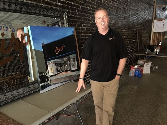 Businessman John Crispens bought the former Akra Bros. department store on Main Street last year. He is renovating it as Crispy's, a more than 150-seat restaurant, bar, art gallery, music venue and dry-cleaning service.