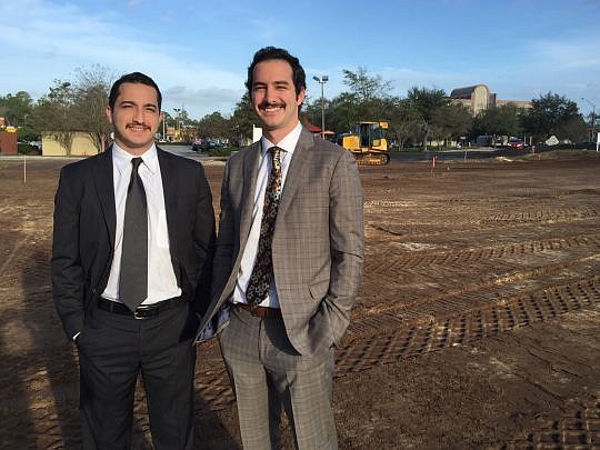 Brothers Paul and Louis Sleiman, sons of developer Peter Sleiman, created Triforce Development LLC. They are standing on the site of their first project, Galleria Marketplace, at Butler Point and Bonneval roads.