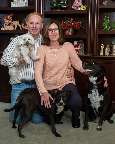 Bob Williams; his fiancÃ©e, Kathy Dodrill; and their rescue dogs, Charlie, Spice and Millie pose for a family portrait. Williams runs a website and Facebook page that helps reunite families and lost pets, as well as serve as a clearinghouse for pet-re...