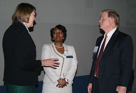 Kathleen Carey, Urban Land Institute chief content officer, left, talks with Nicole Thomas, Baptist Health's senior vice president of specialty services, and Lee Nelson, University of Florida real estate director at Tuesday's ULI annual Emerging Trend...