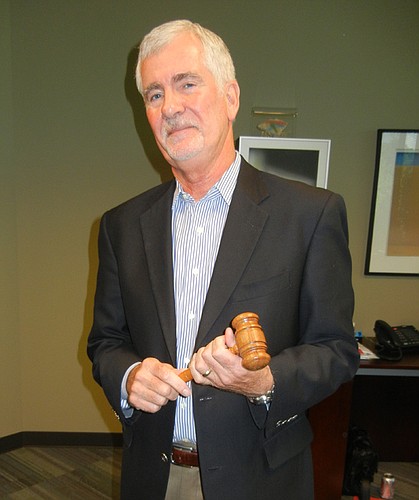 Photo by Karen Brune Mathis - Peter Goplerud became dean of Florida Coastal School of Law in Jacksonville in 2004. He made the gavel he holds (above) during seventh or eighth-grade shop class in Iowa, heading toward a career in the law. A graduate of ...