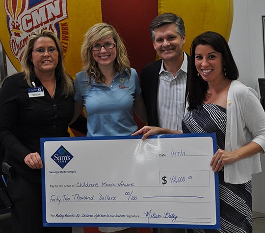 Sam's Club 8253 presented a check for $42,000 Sept. 7 to Children's Miracle Network Hospitals at its Busch Drive location. Pictured above are Sam's Club 8253 Manager Melissa Bailey, Children's Miracle Network Community Development Coordinator Kelly No...