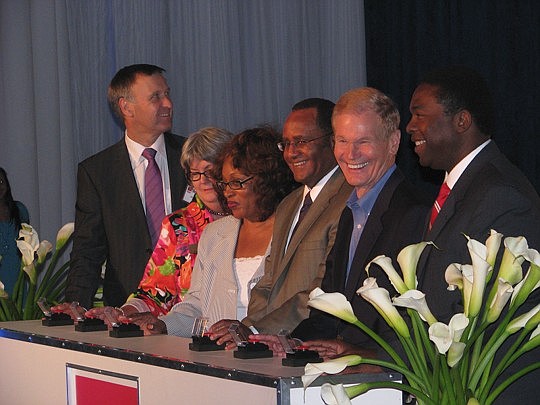 Photo by Joe Wilhelm Jr. - From left, Saft CEO John Searle; Adele Griffin of U.S. Sen. Marco Rubio's office; U.S. Rep Corrine Brown; Vice Adm. Melvin Williams who serves as Associate Deputy Secretary of Energy; U.S. Sen. Bill Nelson; and Mayor Alvin B...