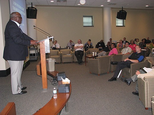 Photos by Joe Wilhelm Jr. - Senior U.S. District Judge Henry Lee Adams Jr. talks to a group of teachers during "A Day in Federal Court: Teaching the Constitution" Tuesday at the Bryan Simpson U.S. Courthouse.