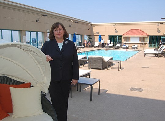 Photo by Max Marbut - Pat Trammell, senior director of Sales &amp; Marketing at the Hyatt Regency Jacksonville Riverfront, on the hotel's recently redecorated rooftop pool deck.