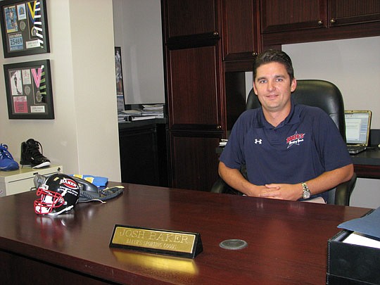 Photo by Joe Wilhelm Jr. - Baker's Sporting Goods owner Josh Baker at the company's new corporate offices near Beach Boulevard and Florida 9A. The company moved into the new corporate warehouse office six months ago.