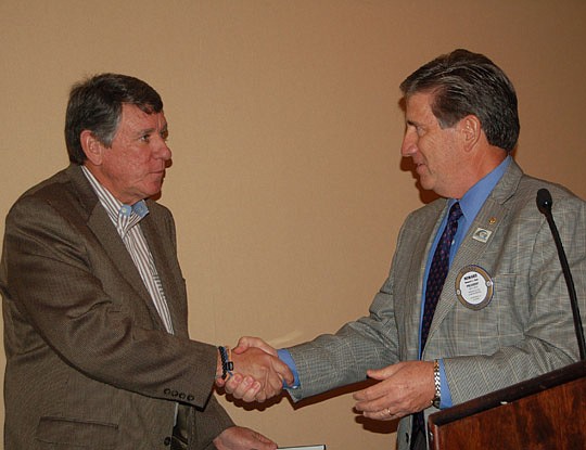 Photo by Max Marbut - Gator Bowl Association President and CEO Rick Catlett and Rotary Club of Jacksonville President Howard Dale. Catlett was the guest speaker at the club's meeting Monday at the Wyndham Hotel on the Southbank.