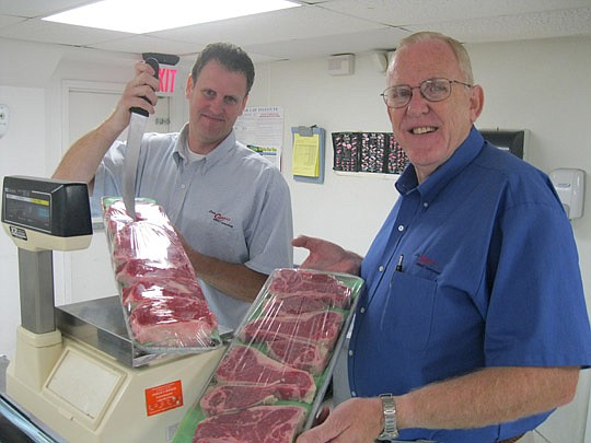 Photo by David Chapman - For almost 15 years, Dan (right) and Christopher Lee have been in the meat business as father and son, owning and managing two locations of Lee's Carroll's Meat Shoppe. The stores have been institutions in Jacksonville since b...