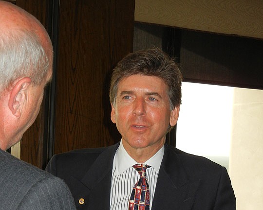 Photo by Karen Brune Mathis - Boulos speaks with Bob Tackett of Total Office Solutions.
