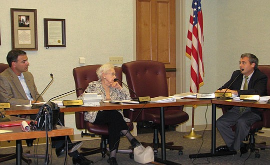 Photo by Joe Wilhelm Jr. - From left, Ethics Commission Chairman Braxton Gillam, Vice Chairwoman Helen Ludwig and member James Young discuss the future of the commission during a meeting Tuesday at City Hall.