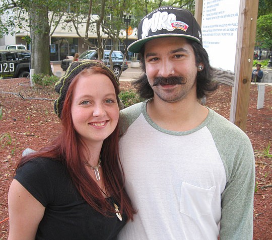 Photos by David Chapman - Fallon Register and Sparky Dray were two Movember volunteers in Hemming Plaza. They helped people make their own paper mustaches and accepted donations toward the Movember cause of men's health, specifically prostate cancer.
