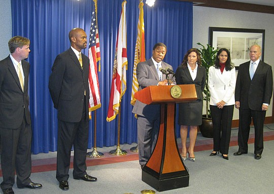 Photo by David Chapman - Mayor Alvin Brown (at podium) announced five appointments Thursday. He named (from left) Jack Shad, community planner; Calvin Burney, planning director; Renee Finley, Office of Public-Private Partnerships commissioner; Betzy S...