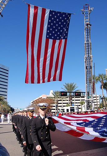 Photo by Max Marbut - There was more than a mile of red, white and blue Downtown Friday for the City's annual Veterans Day Parade. More than 3,500 people marched and rode this year, led by Mayor Alvin Brown.