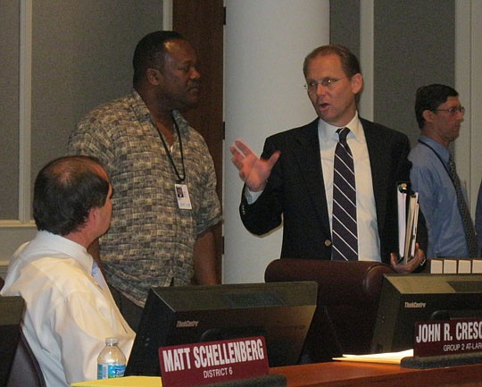Photo by David Chapman - Kevin Hyde (right), Mayor Alvin Brown's chief administrative officer, talks with Council members Johnny Gaffney (standing) and John Crescimbeni  after a Council workshop on Brown's reorganization plan.