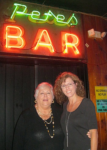 Photos by Joe Wilhelm Jr. - People along the Beaches and around Jacksonville have embraced a Thanksgiving tradition: the street party at Pete's Bar. At right, co-owner Nancy Jensen (left) and her daughter, Nancy Jo Campbell, will be there today helpin...