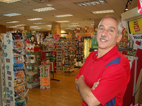 Photo by Max Marbut - Doug Ganson at Sundrez, his gift shop and convenience store at the Landing.
