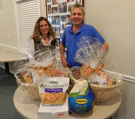 Horizon Board members Donna Bernardis and George Israel packed food baskets to be delivered to Dreams Come True families in need this holiday season.
