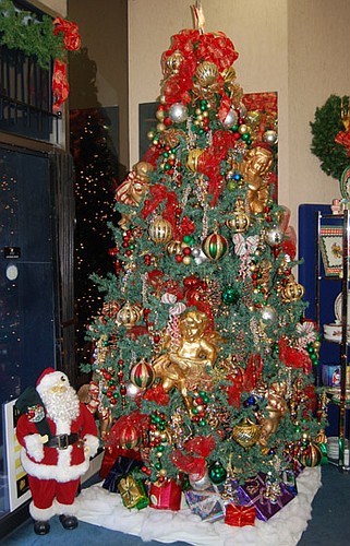 Photos by Max Marbut - This decorated tree at Jacobs Jewelers is a Downtown holiday landmark.