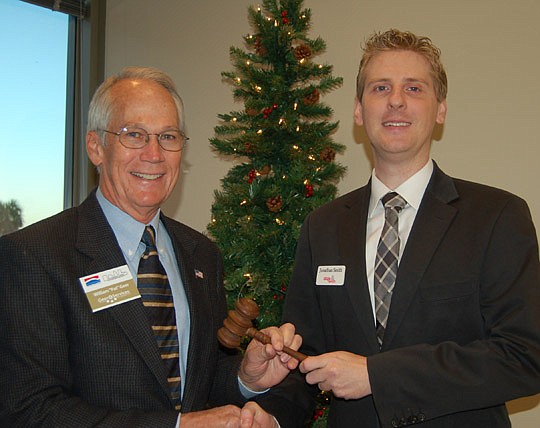 Photos by Max Marbut - Downtown Council 2011 President Pat Geer passed the gavel Friday to his successor, Jonathan Smith.