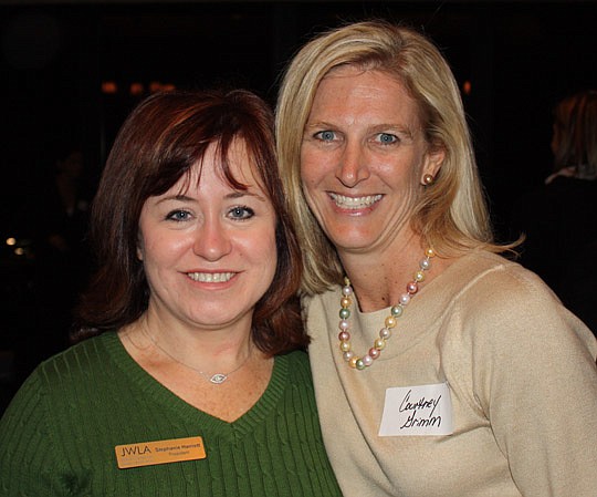 JWLA President Stephanie Harriett and JWLA member Courtney Grimm, former president of The Jacksonville Bar Association, at the holiday party Tuesday at The University Club.